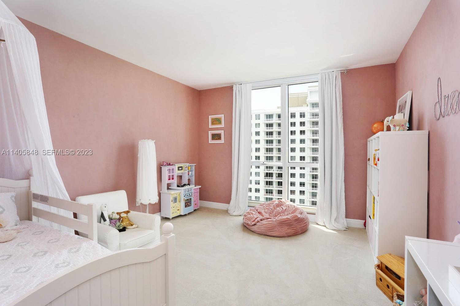 901 Brickell Key Boulevard, Unit 2903 Miami, FL 33131 - Photo 18 of 31 a view of livingroom with furniture and storage