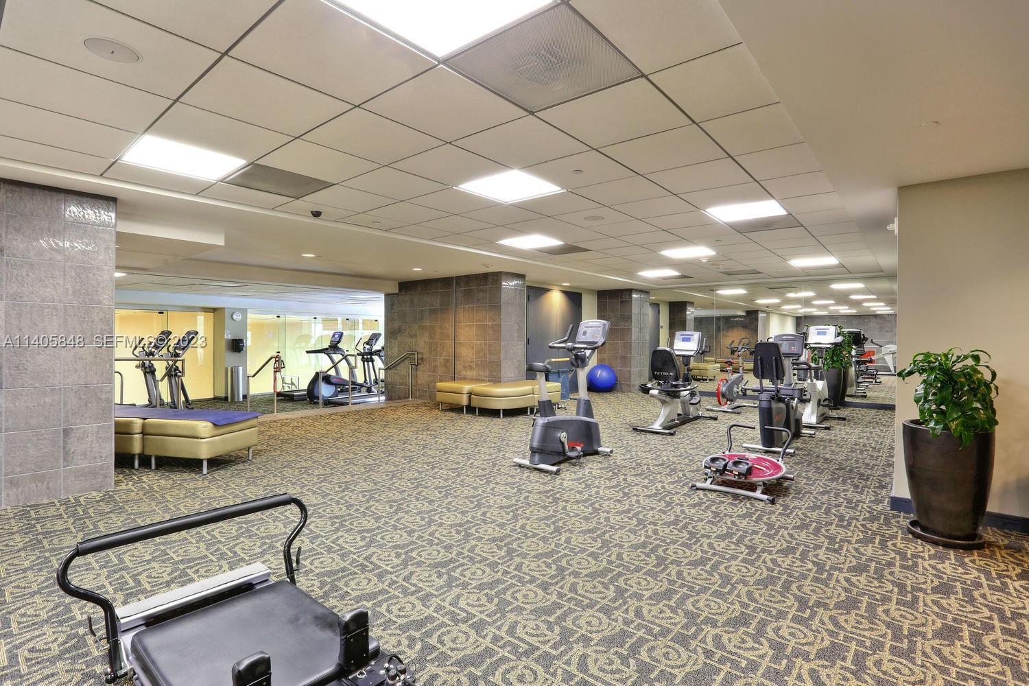901 Brickell Key Boulevard, Unit 2903 Miami, FL 33131 - Photo 24 of 31 a view of a room with gym equipment