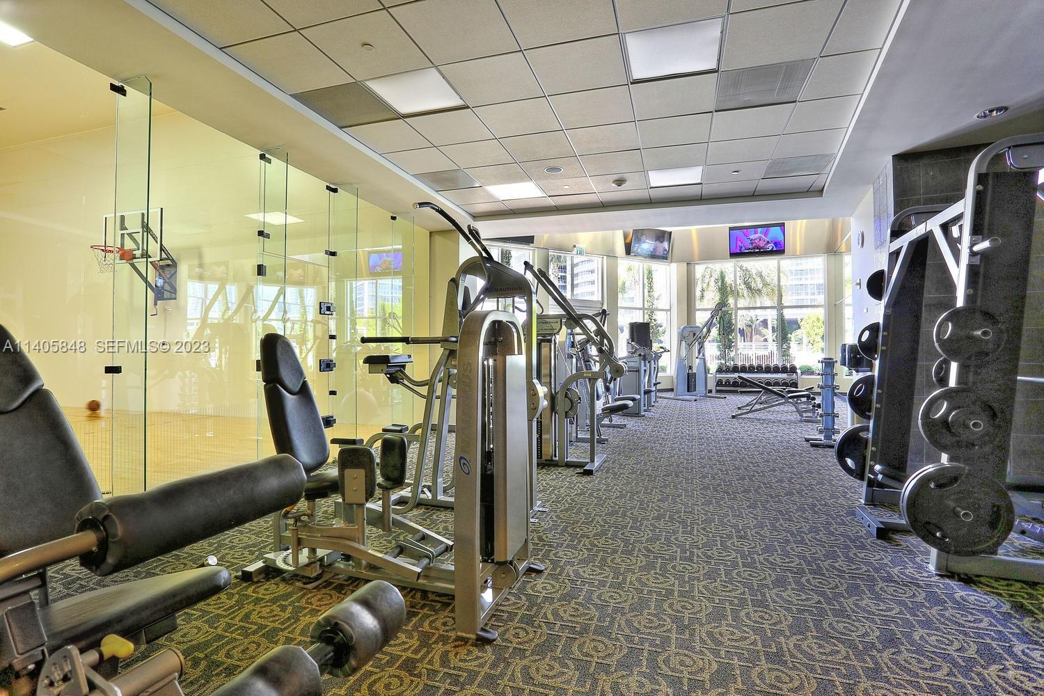 901 Brickell Key Boulevard, Unit 2903 Miami, FL 33131 - Photo 25 of 31 a view of a room with gym equipment