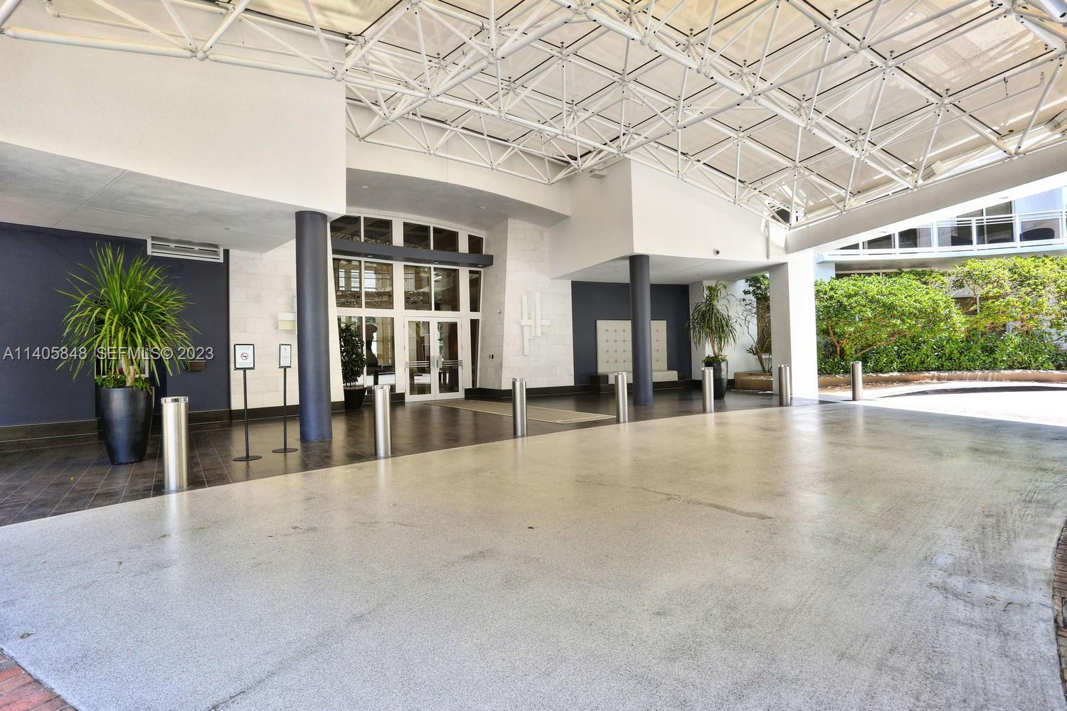 901 Brickell Key Boulevard, Unit 2903 Miami, FL 33131 - Photo 28 of 31 a view of a porch with seating space