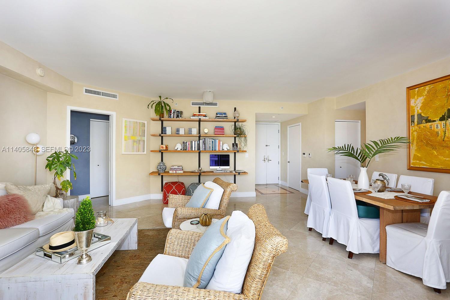 901 Brickell Key Boulevard, Unit 2903 Miami, FL 33131 - Photo 7 of 31 a living room with furniture and a wooden floor