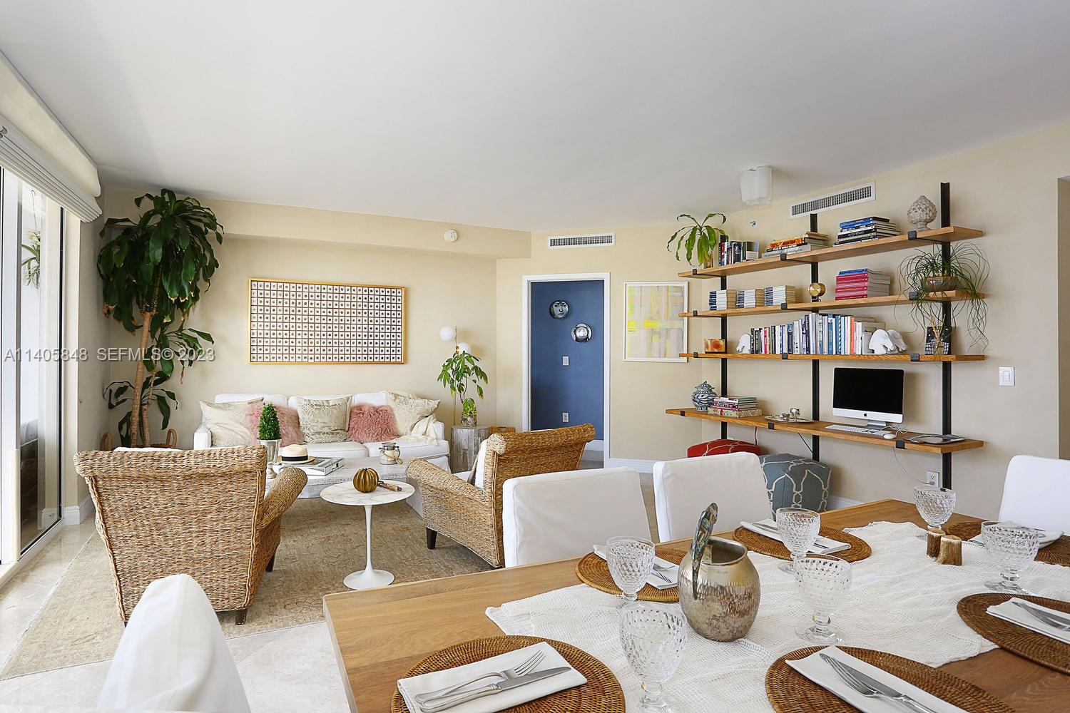 901 Brickell Key Boulevard, Unit 2903 Miami, FL 33131 - Photo 8 of 31 a living room with furniture and a fireplace