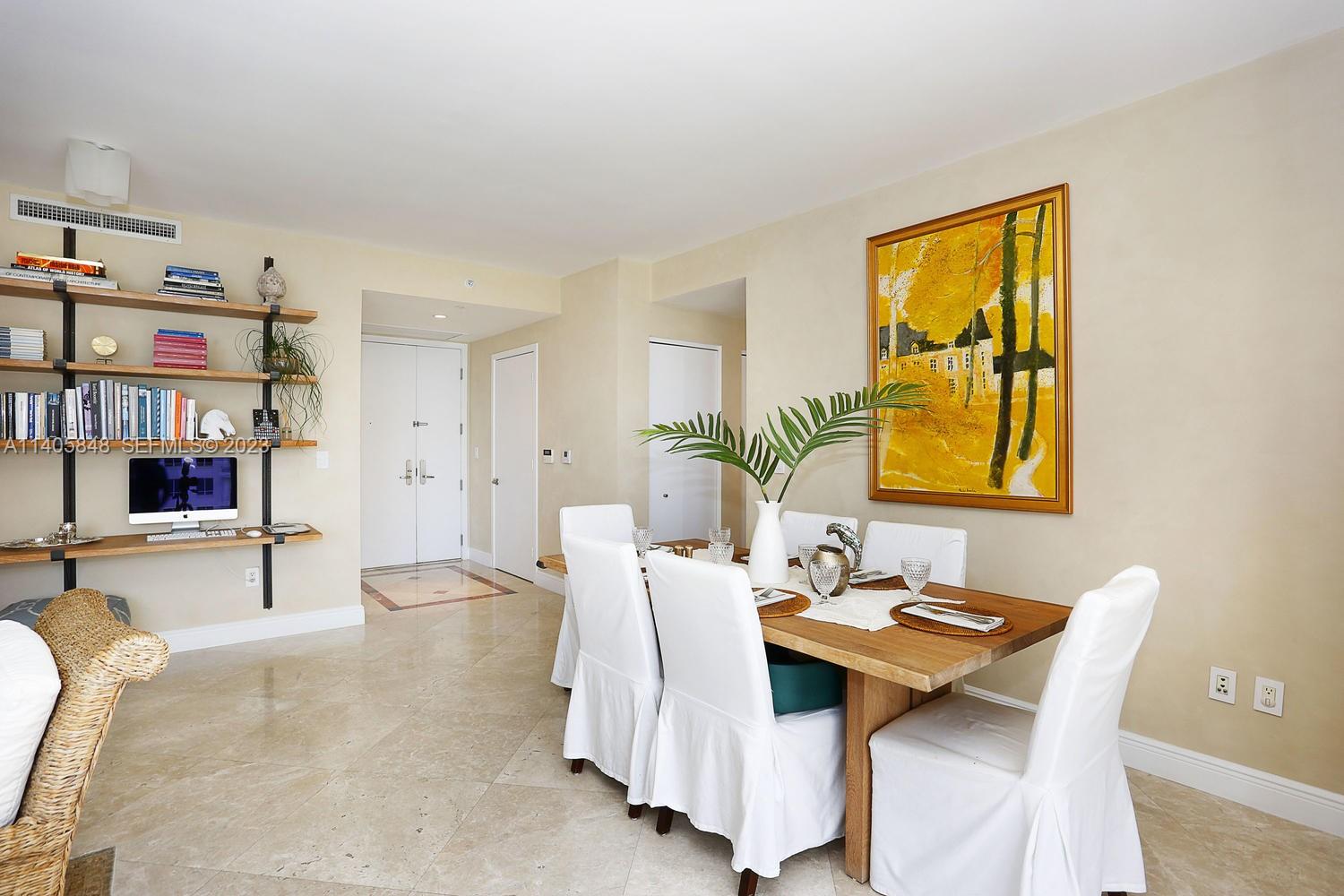 901 Brickell Key Boulevard, Unit 2903 Miami, FL 33131 - Photo 9 of 31 a dining room with furniture and window