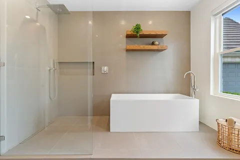 a white bath tub sitting in a bathroom