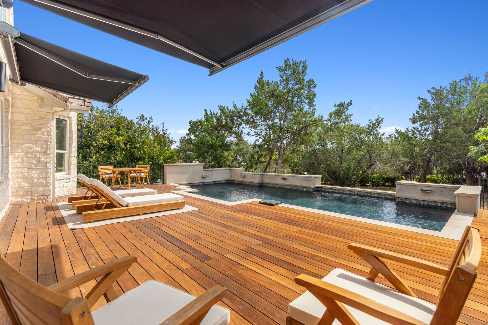1 Sparrowglen Lane Austin, TX 78738 - Photo 2 of 36 a view of swimming pool with seating space