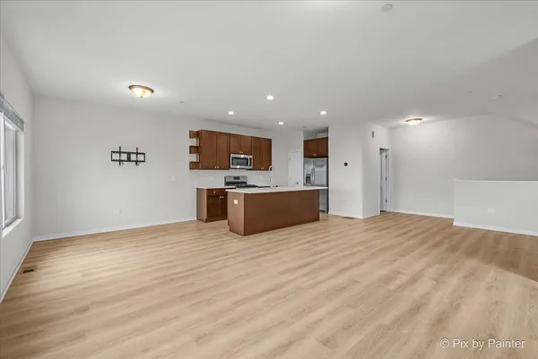 a view of a kitchen with a sink and a microwave