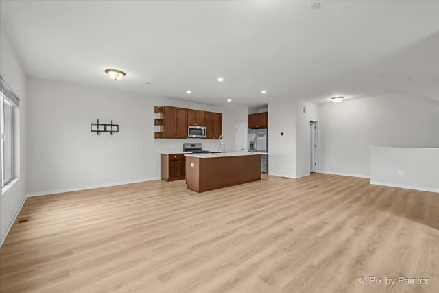 a view of a kitchen with a sink and a microwave