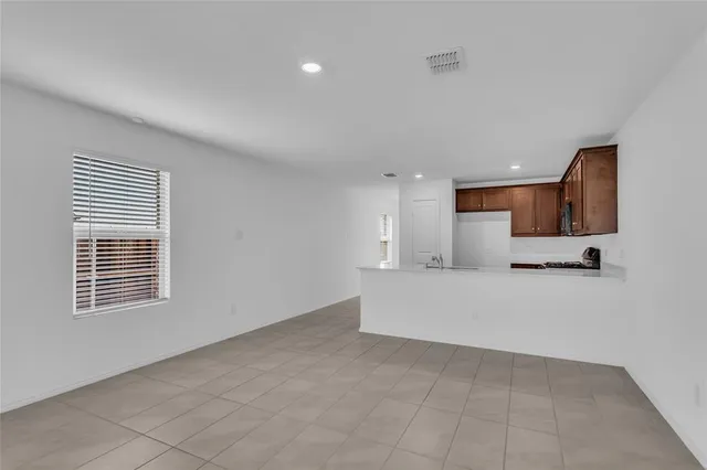 a view of kitchen with furniture and window