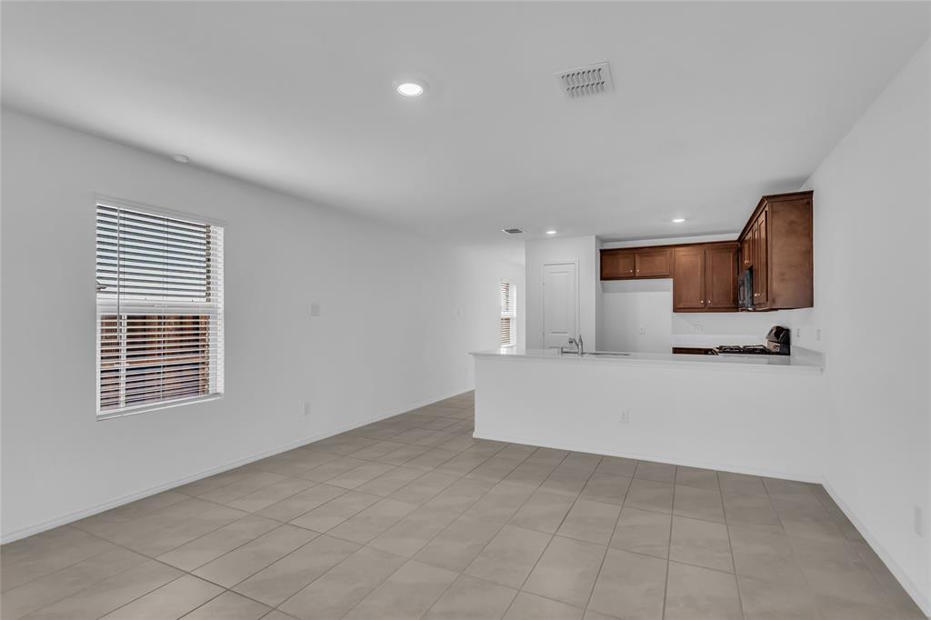 14069 Drover Street Pilot Point, TX 76258 - Photo 11 of 27 a view of kitchen with furniture and window