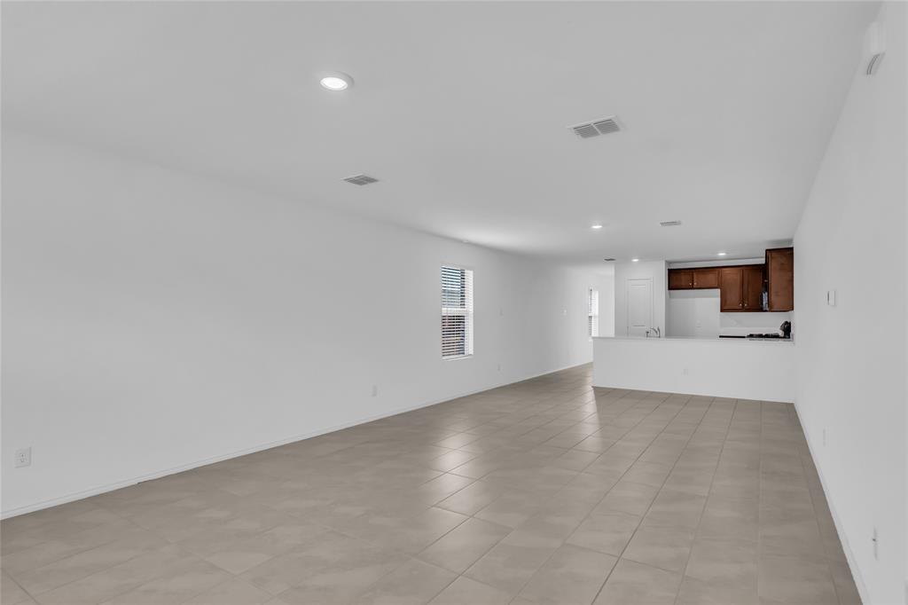 14069 Drover Street Pilot Point, TX 76258 - Photo 14 of 27 a view of empty room with wooden floor