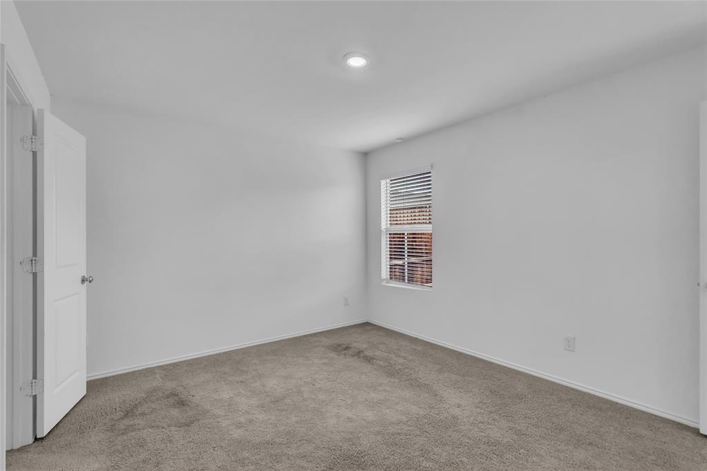 14069 Drover Street Pilot Point, TX 76258 - Photo 17 of 27 an empty room with a window