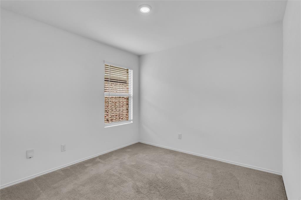 14069 Drover Street Pilot Point, TX 76258 - Photo 21 of 27 a view of an empty room with a window