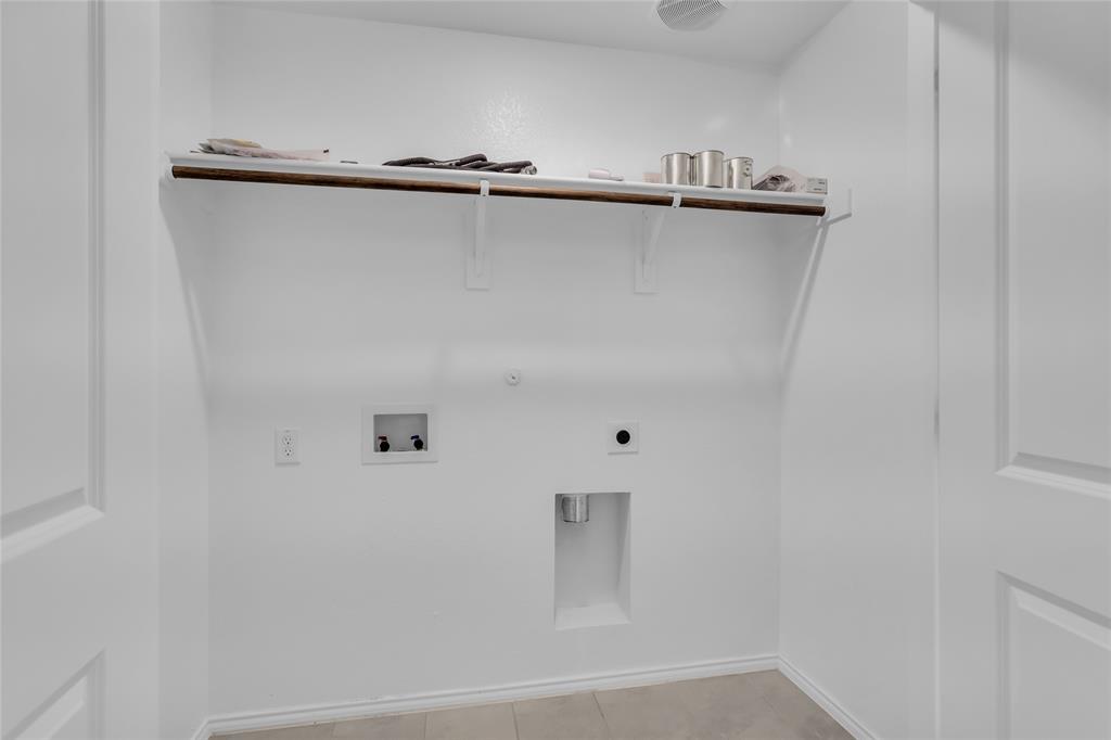 14069 Drover Street Pilot Point, TX 76258 - Photo 23 of 27 a close view of a refrigerator in kitchen