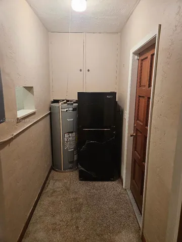 a kitchen with a refrigerator freezer and a dishwasher