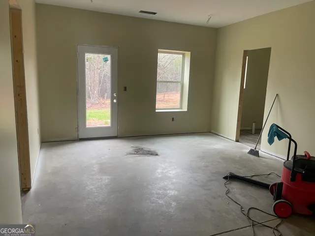 a view of livingroom with furniture and window