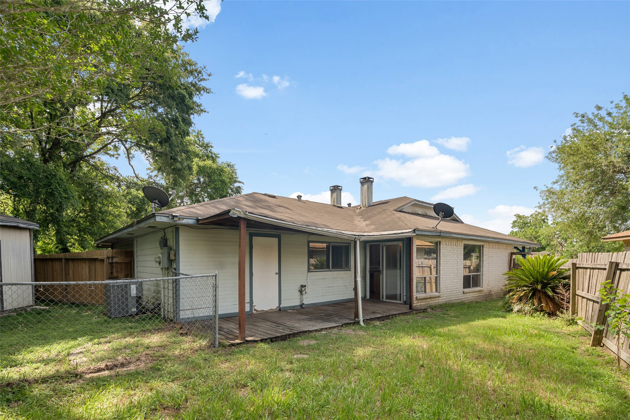 3119 Oak Rock Spring, TX 77373 - Photo 19 of 25 a view of a house with a yard and tree