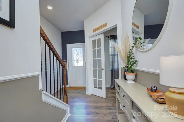 a room with furniture and wooden floor
