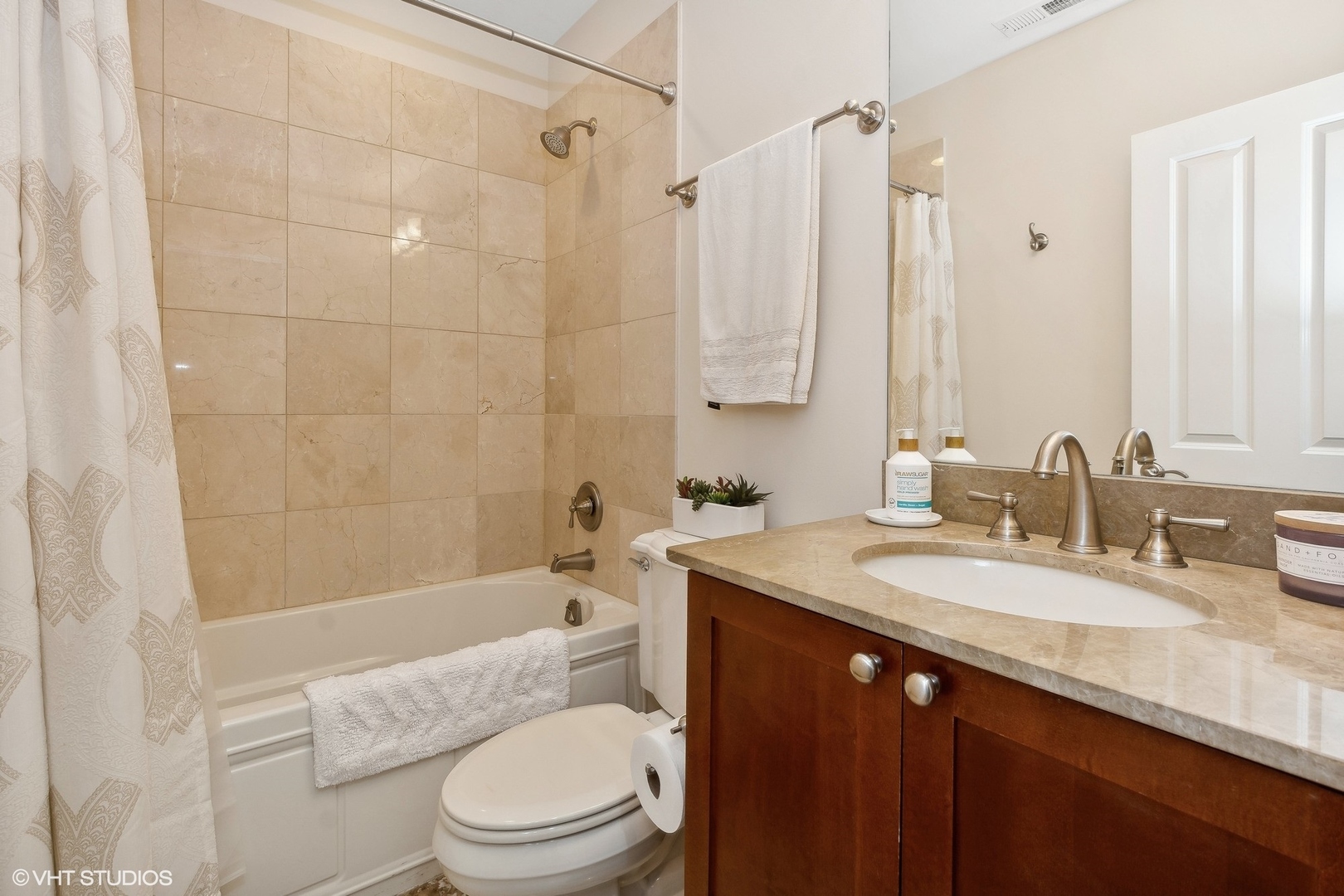 3003 West Cornelia Avenue Chicago, IL 60618 - Photo 16 of 25 a bathroom with a granite countertop sink toilet and shower