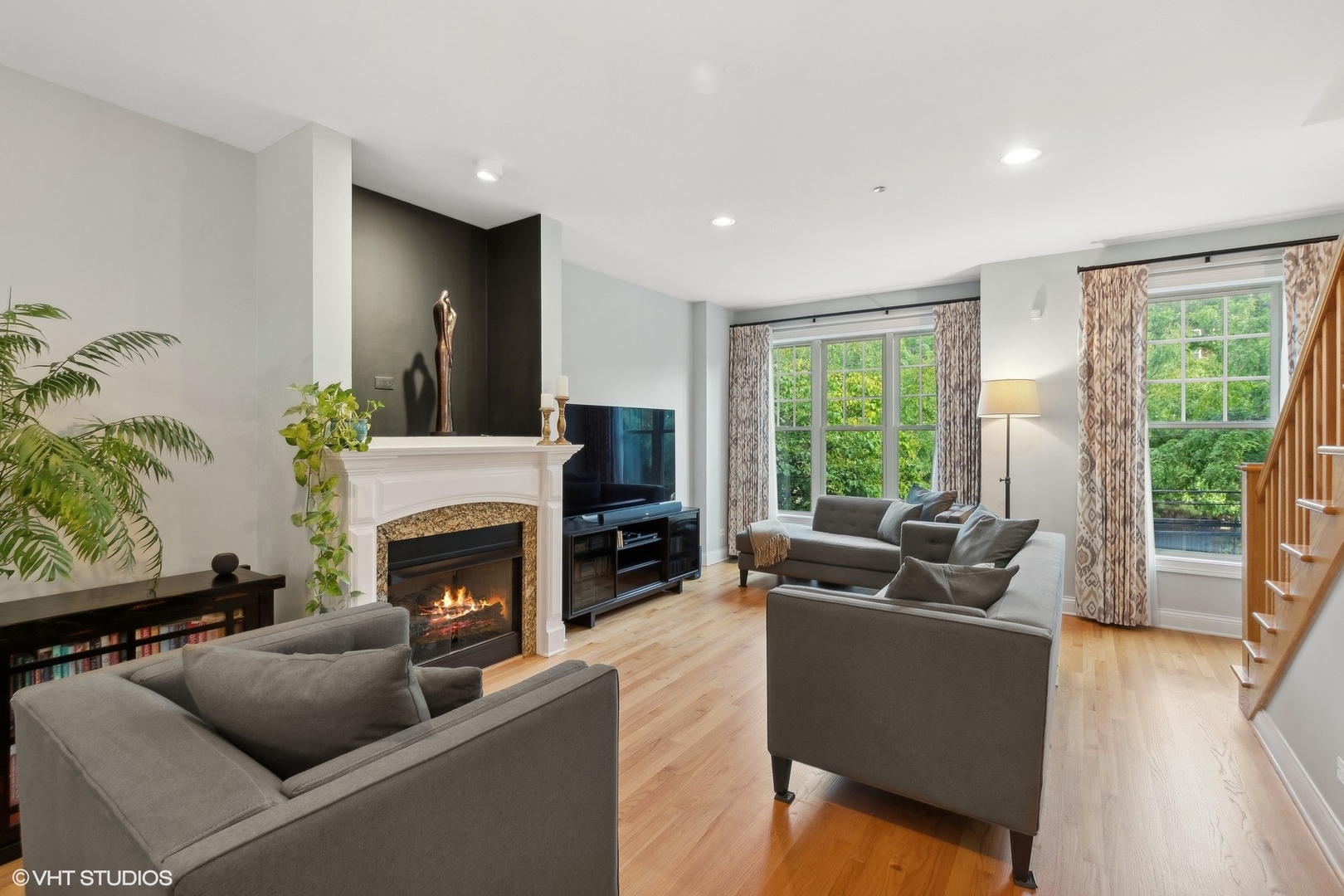 3003 West Cornelia Avenue Chicago, IL 60618 - Photo 2 of 25 a living room with furniture fireplace and flat screen tv