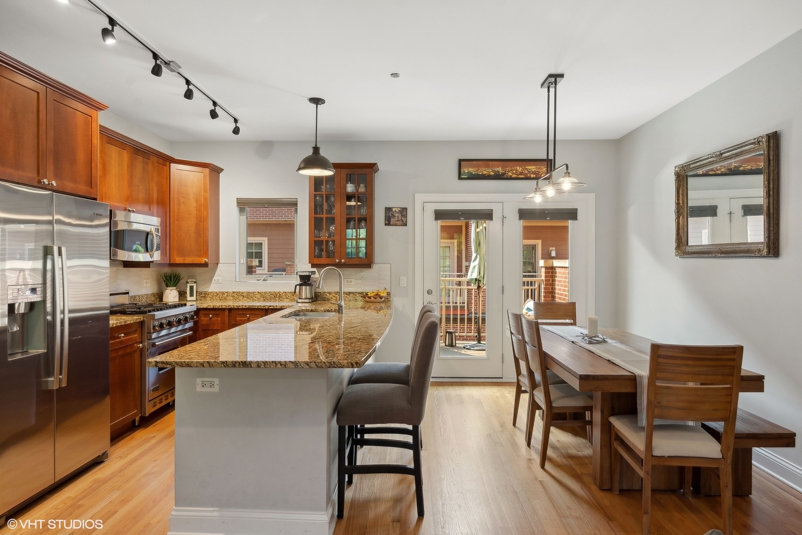 3003 West Cornelia Avenue Chicago, IL 60618 - Photo 5 of 25 a view of a dining room with furniture window and wooden floor