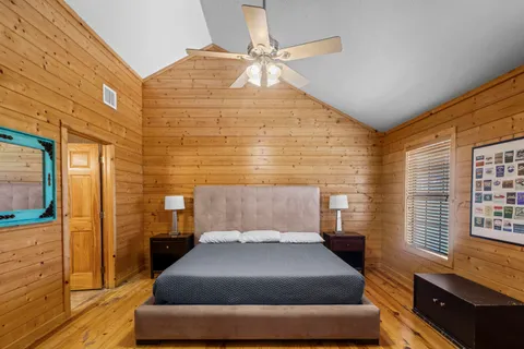 a bedroom with a bed and window