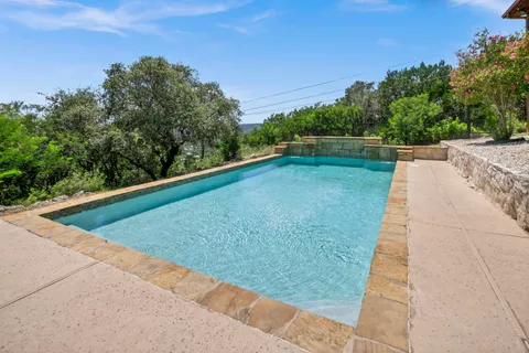 a view of a pool with a yard