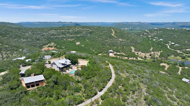 a view of a lake in middle of forest