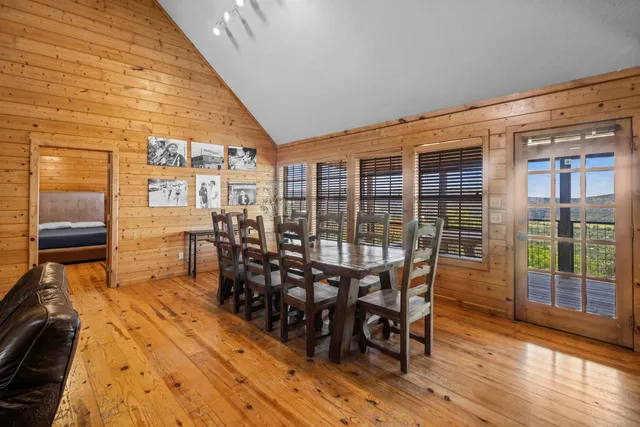 a dining room with furniture and wooden floor