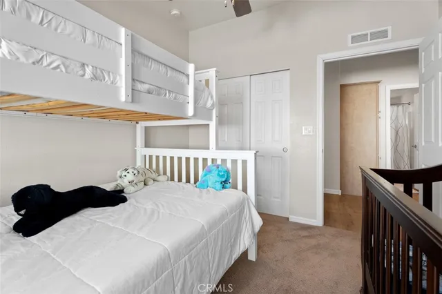 a bedroom with a bed and dresser