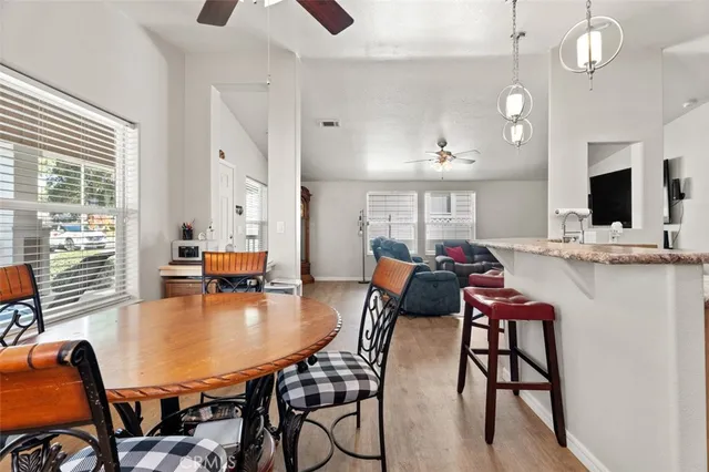 a dining room with furniture and window