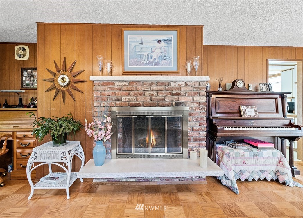 120 161st Street Southeast Bothell, WA 98012 - Photo 14 of 26 a living room with furniture and a fireplace