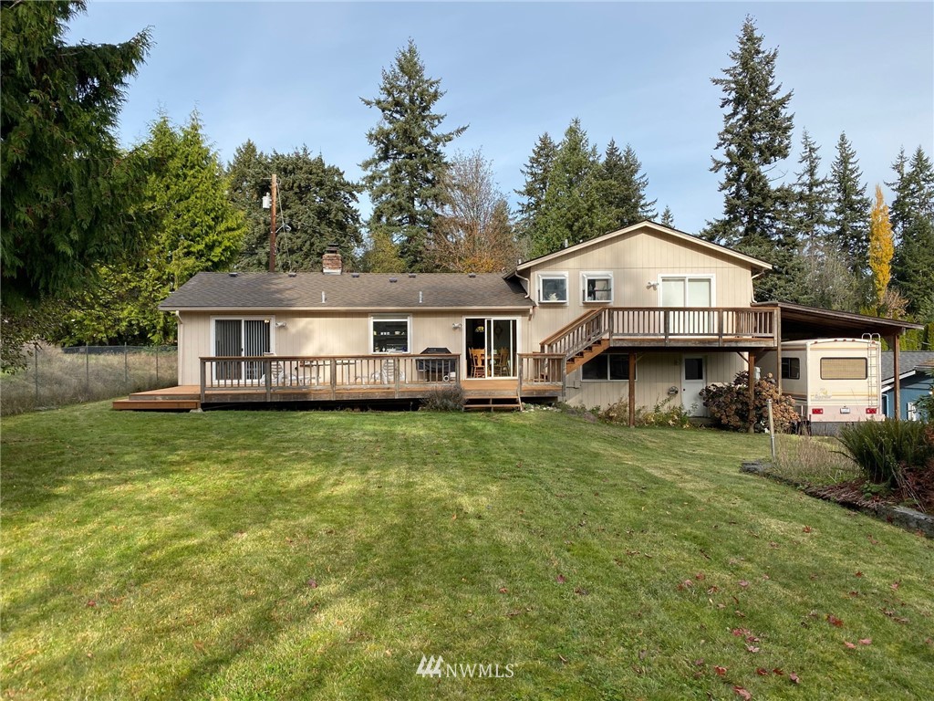 120 161st Street Southeast Bothell, WA 98012 - Photo 22 of 26 a front view of a house with a garden and porch