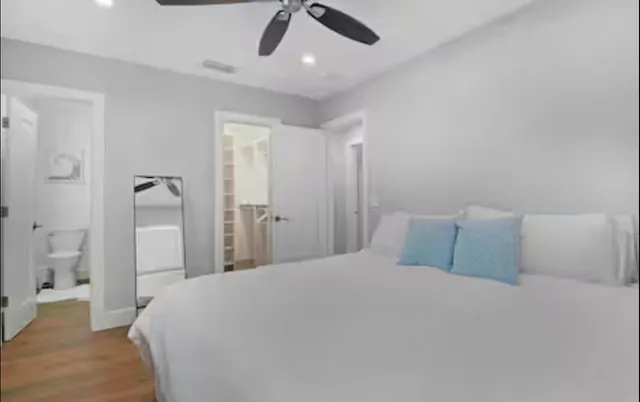 a bedroom with a bed and a walk in closet