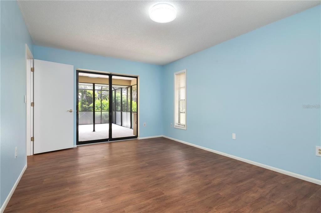 133 1st Avenue Nokomis, FL 34275 - Photo 22 of 32 wooden floor in an empty room with a window