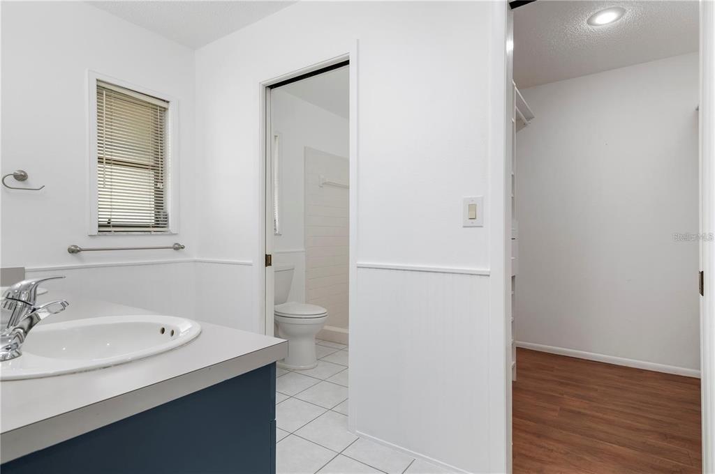 133 1st Avenue Nokomis, FL 34275 - Photo 23 of 32 a bathroom with a sink and a mirror