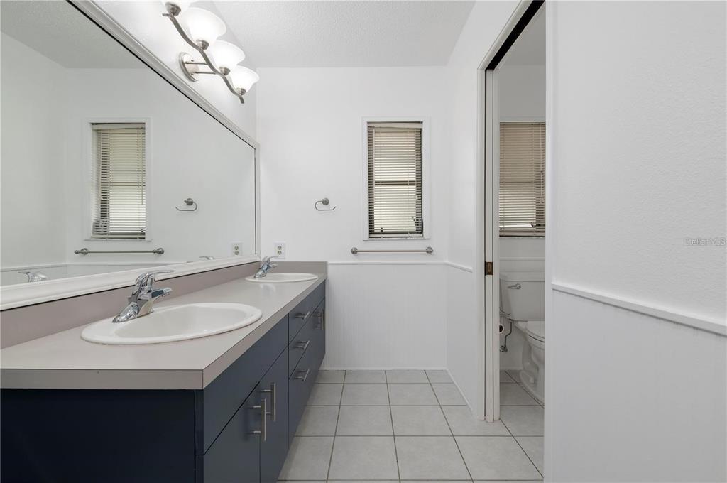 133 1st Avenue Nokomis, FL 34275 - Photo 24 of 32 a bathroom with a sink and a mirror