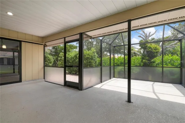 a view of an empty room with sliding glass door