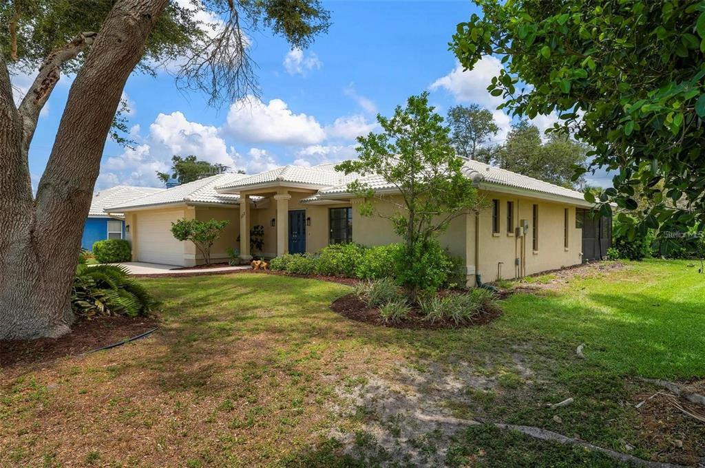 133 1st Avenue Nokomis, FL 34275 - Photo 29 of 32 a view of a house with a backyard