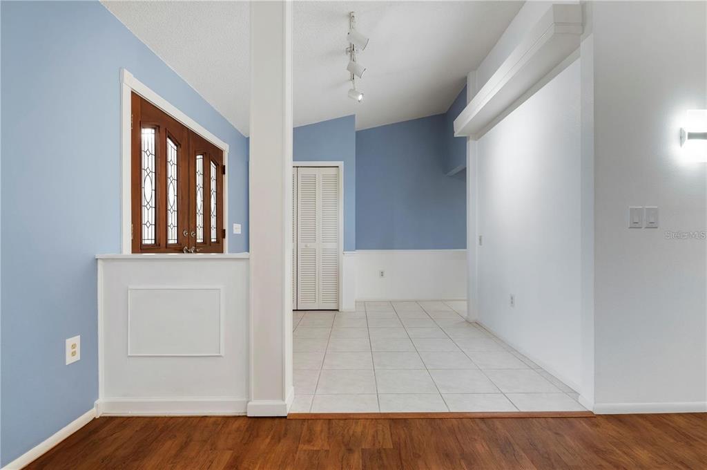 133 1st Avenue Nokomis, FL 34275 - Photo 7 of 32 wooden floor in an empty room with a window