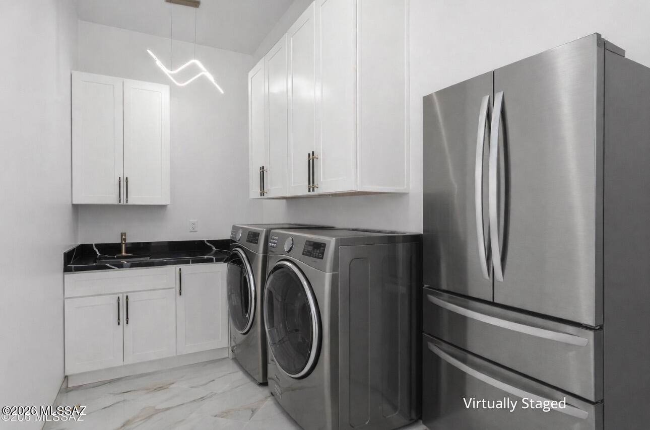 1786 Peralta Court Rio Rico, AZ 85648 - Photo 25 of 50 a kitchen with stainless steel appliances granite countertop a refrigerator and a stove