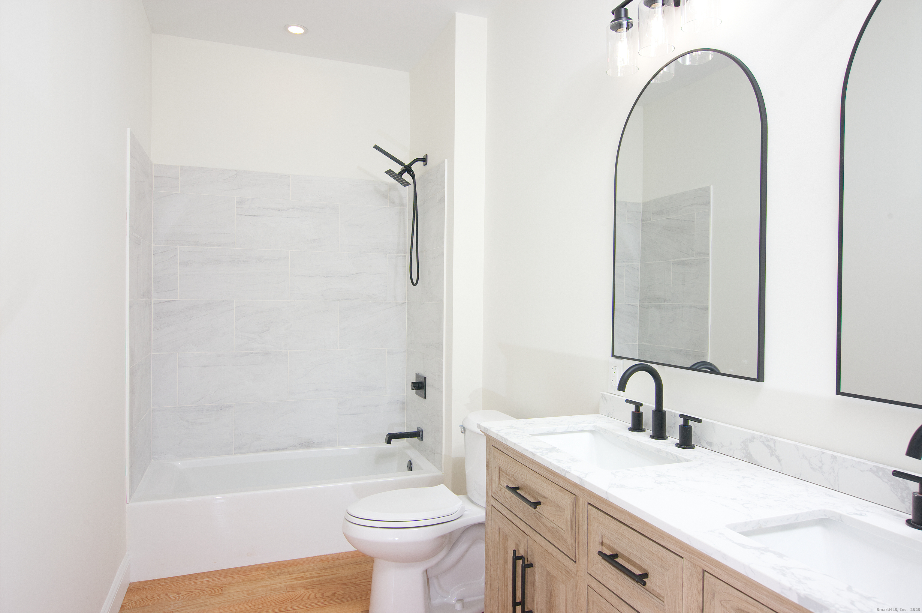 151 Benz Street Ansonia, CT 06401 - Photo 13 of 29 a bathroom with a sink and a mirror