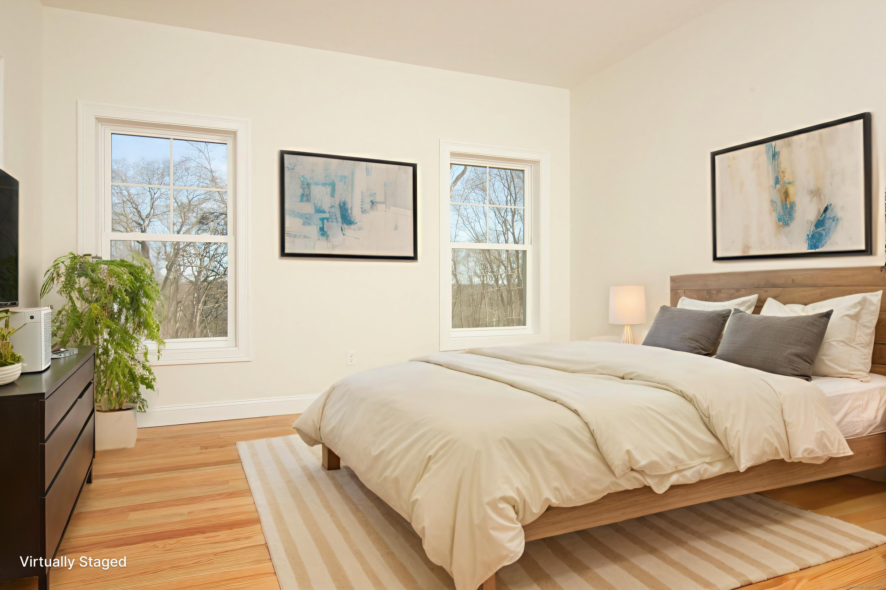 151 Benz Street Ansonia, CT 06401 - Photo 14 of 29 a bedroom with a bed and a painting on the wall