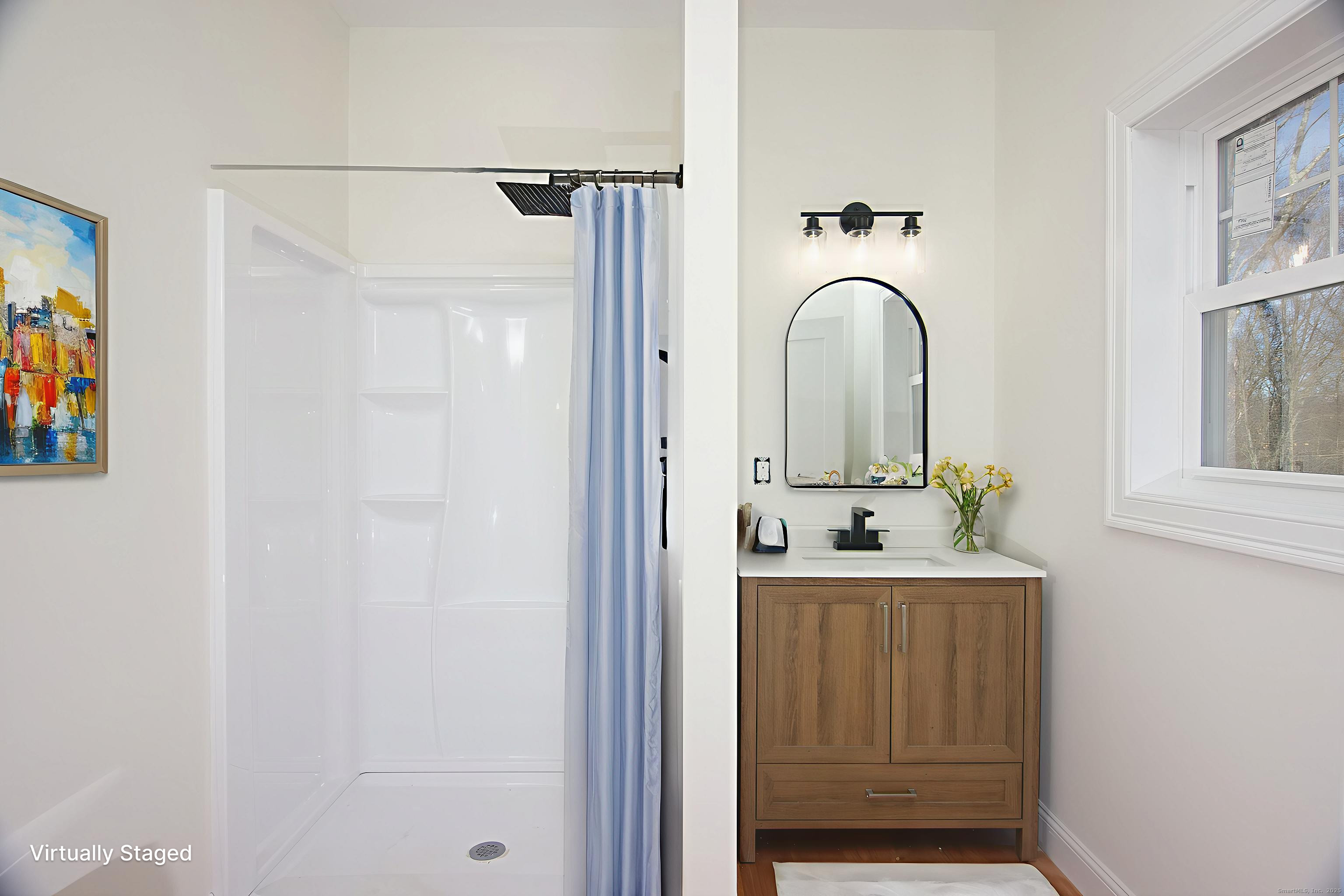 151 Benz Street Ansonia, CT 06401 - Photo 17 of 29 a bathroom with a sink and mirror with bathtub