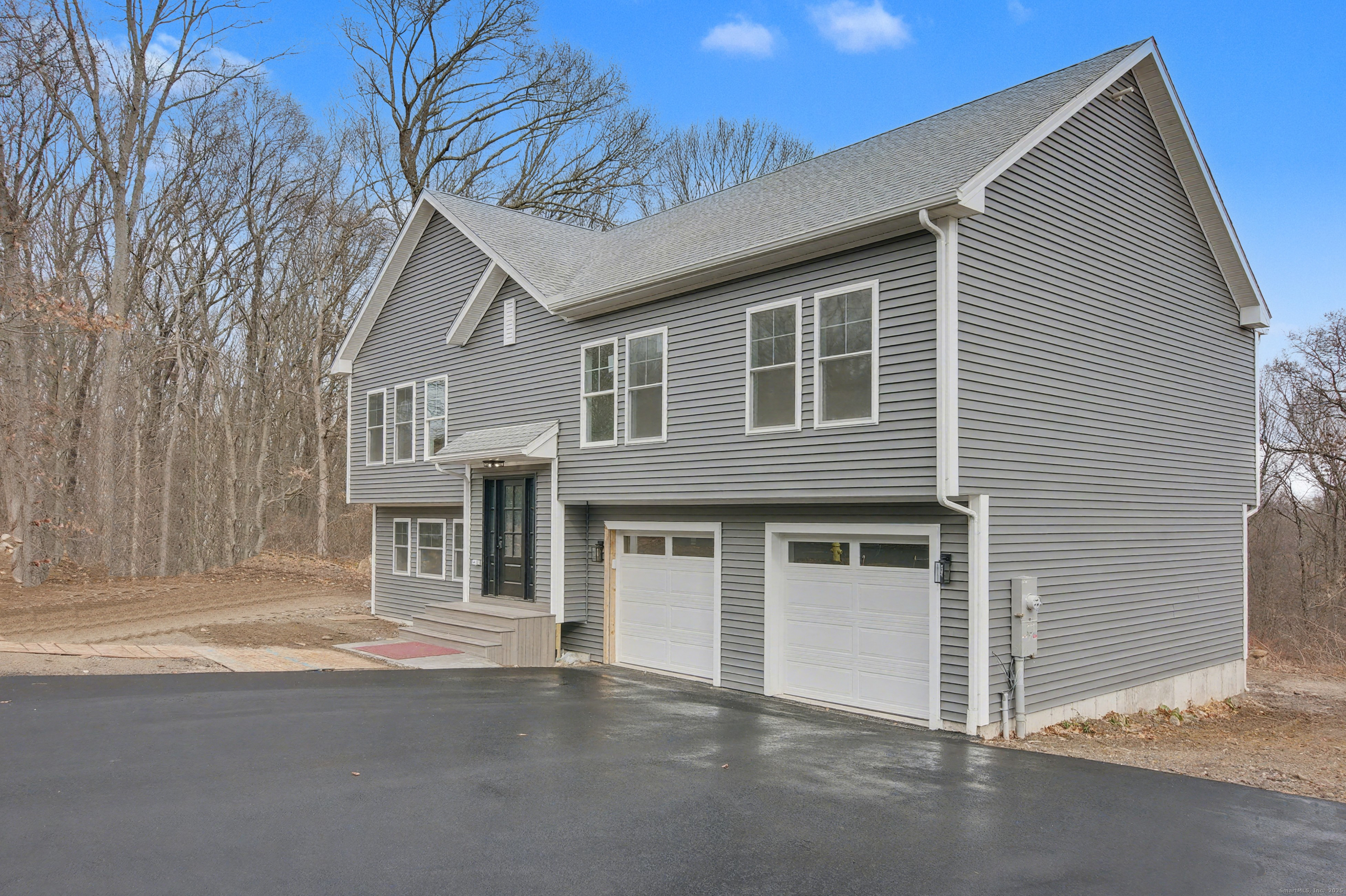 151 Benz Street Ansonia, CT 06401 - Photo 2 of 29 a front view of a house with a garage