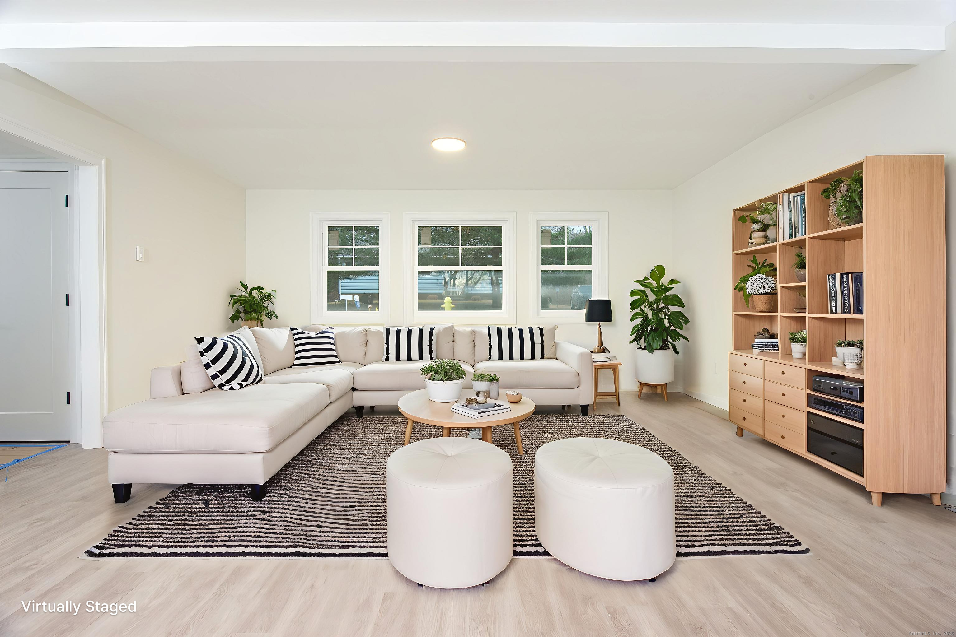 151 Benz Street Ansonia, CT 06401 - Photo 26 of 29 a living room with furniture and a couch
