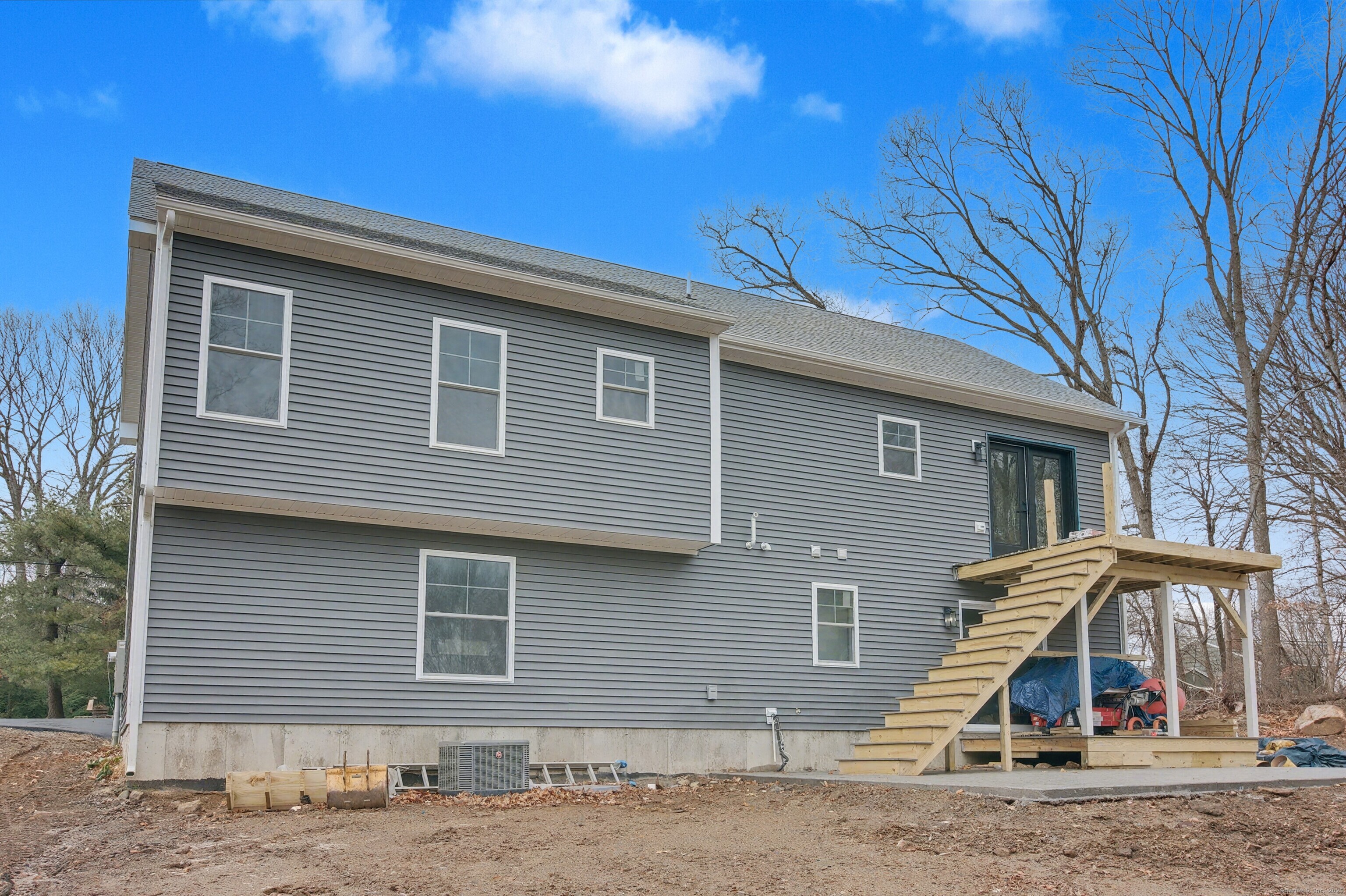 151 Benz Street Ansonia, CT 06401 - Photo 3 of 29 a side view of a house with a yard