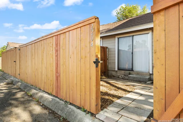a view of a back yard of the house