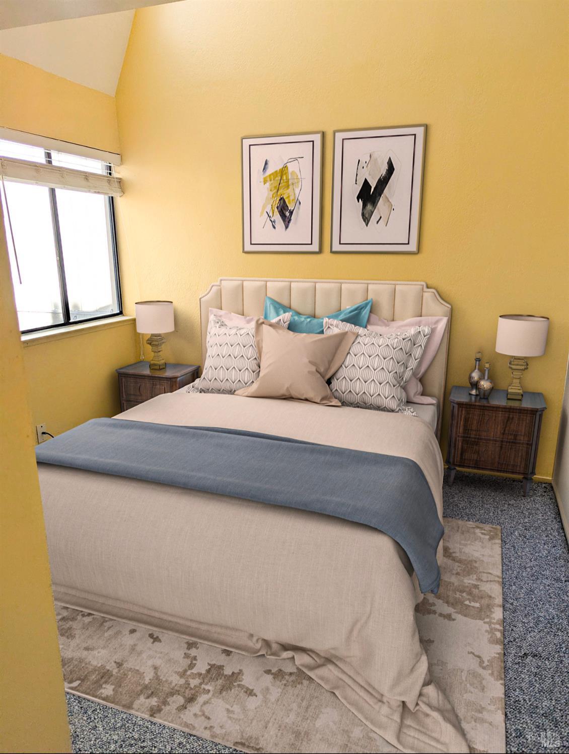 a bedroom with a bed and a painting on the wall