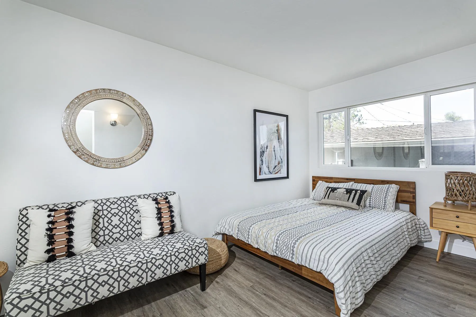 802 Vanderbilt Place San Diego, CA 92103 - Photo 14 of 14 a bedroom with a bed flowerpot and window
