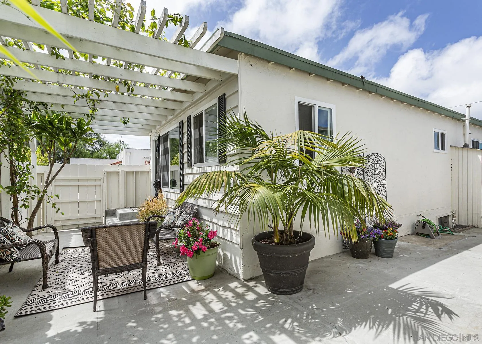 802 Vanderbilt Place San Diego, CA 92103 - Photo 4 of 14 a potted plant sitting in front of a house